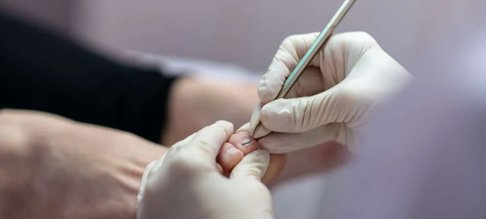 Podiatrist working on a patient's feet.