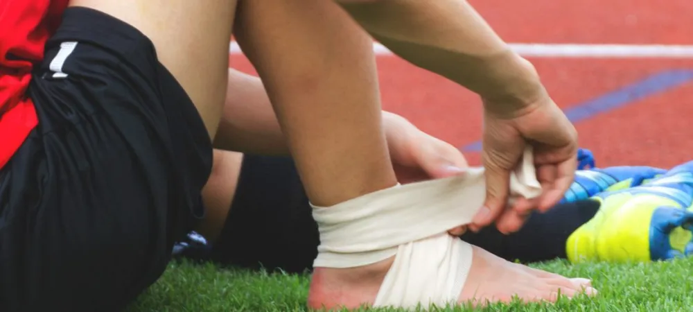 a woman sitting on the grass.