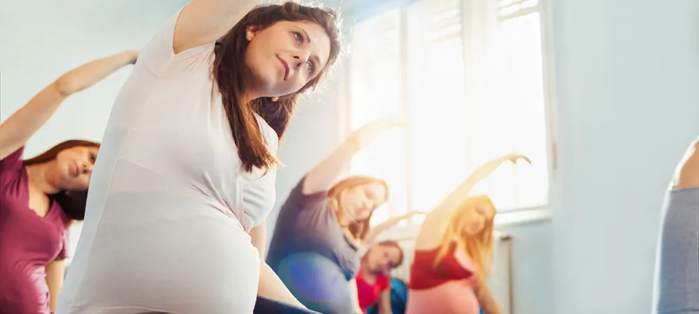 a woman doing yoga in a room.