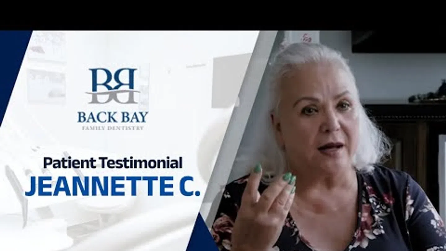 Patient testimonial from Jeannette C. for Back Bay Family Dentistry, featuring a smiling elderly woman.