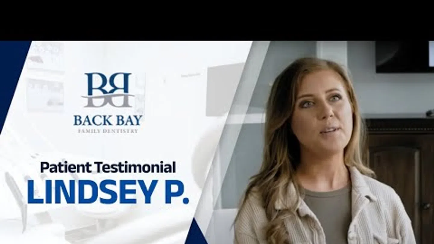 Patient testimonial featuring Lindsey P. for Back Bay Family Dentistry with dental office background.