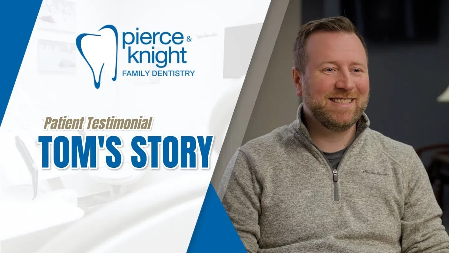 Smiling man shares his testimonial for Pierce & Knight Family Dentistry in a professional setting.