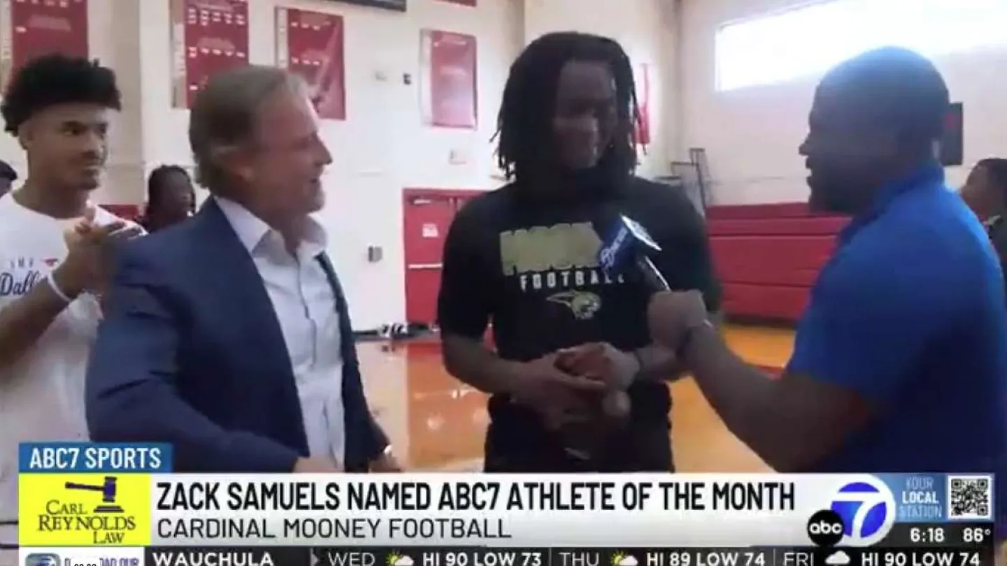 Zack Samuels named ABC7 Athlete of the Month in a gym interview with reporters and teammates.