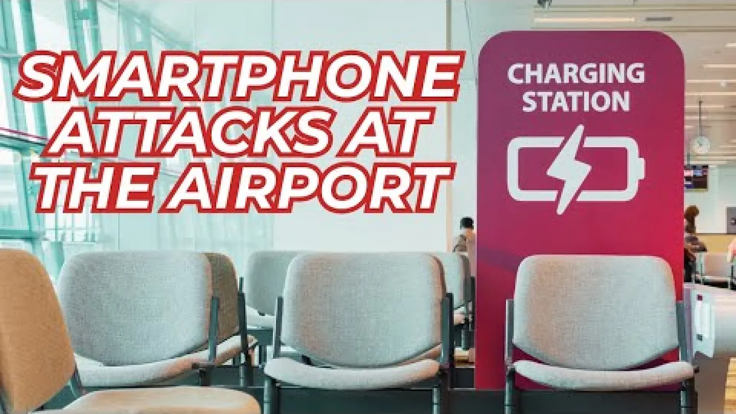 Empty airport seating area next to a red charging station with smartphones attacks warning text