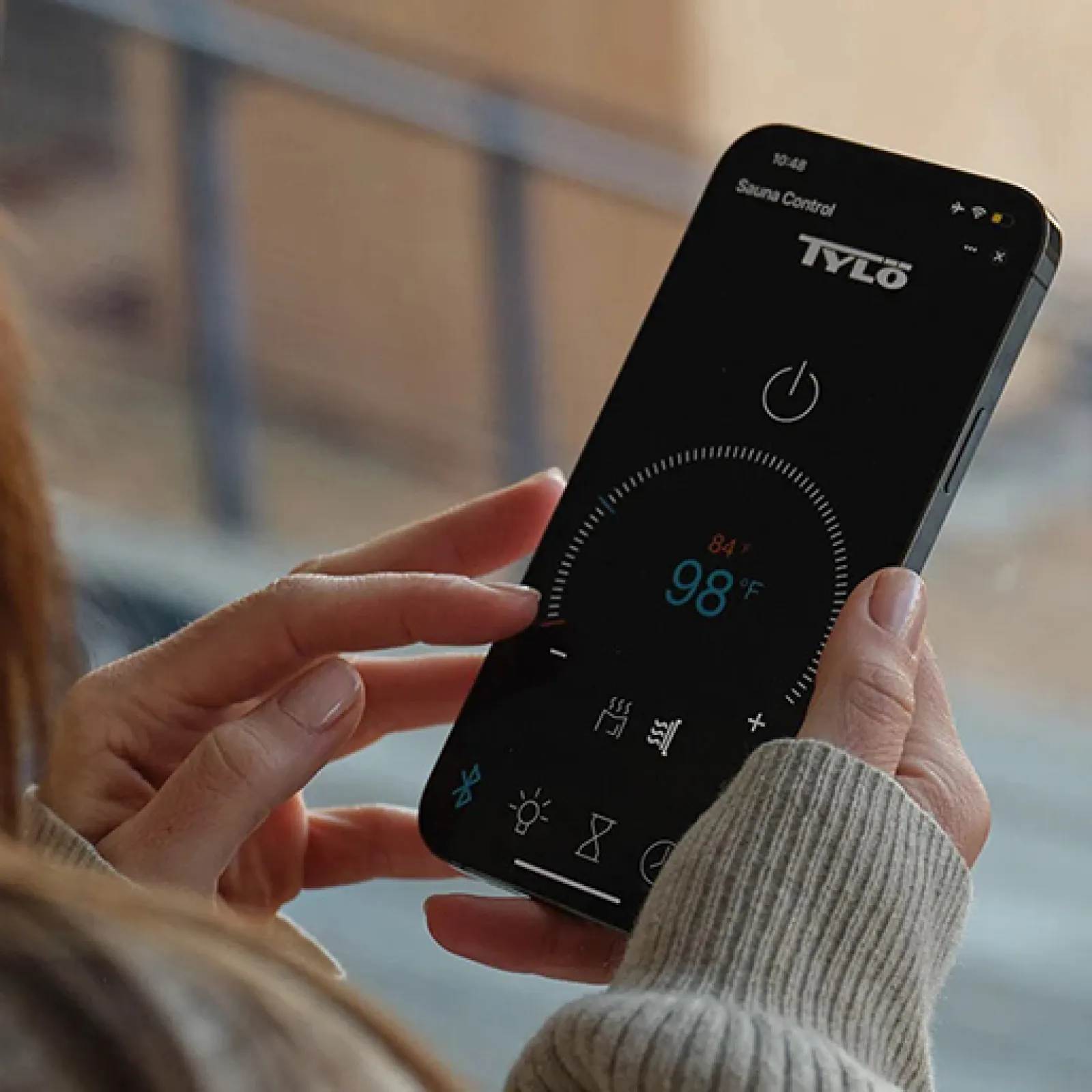 a woman holding a phone