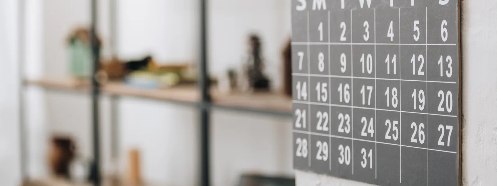 a black and white calendar on the wall
