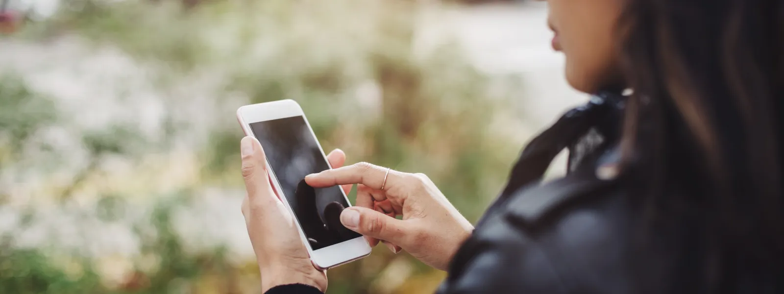 a woman scrolling touching her smartphone