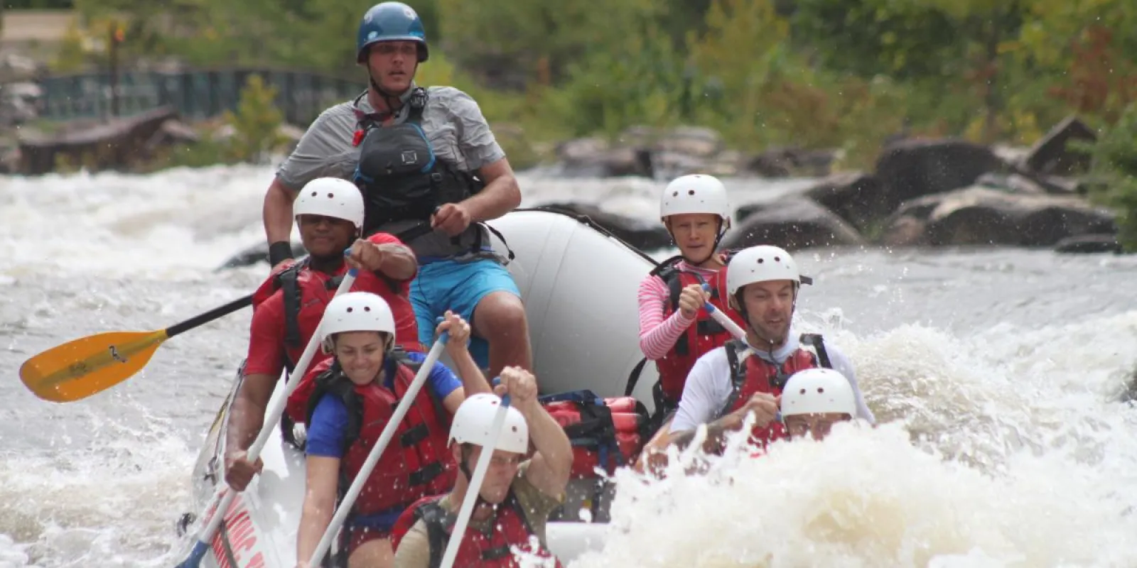 a group of people riding on a raft