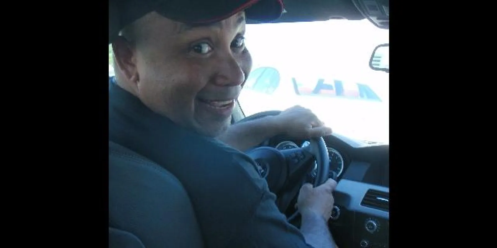 Steve driving a car