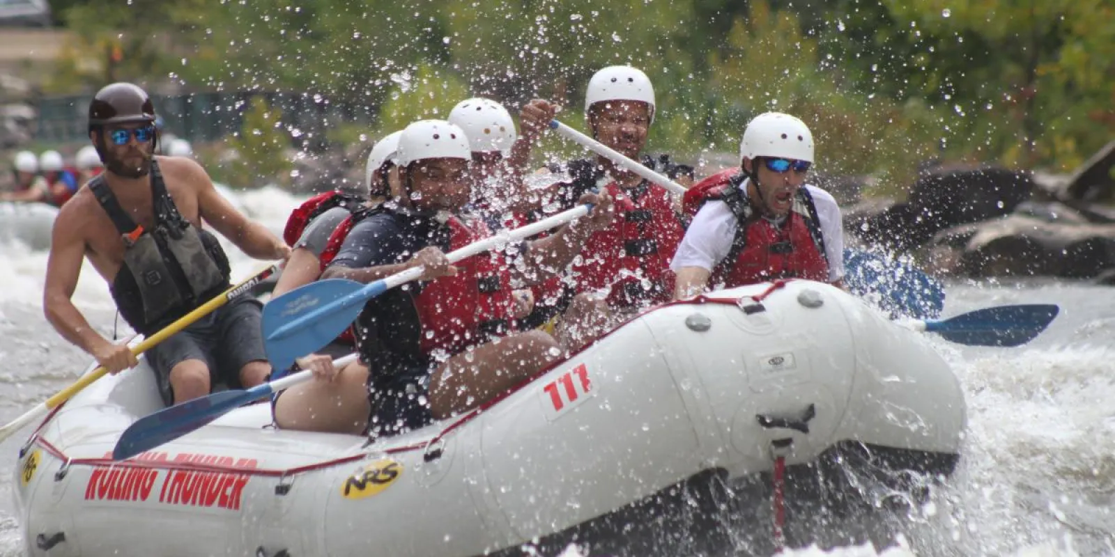 a group of people riding a raft