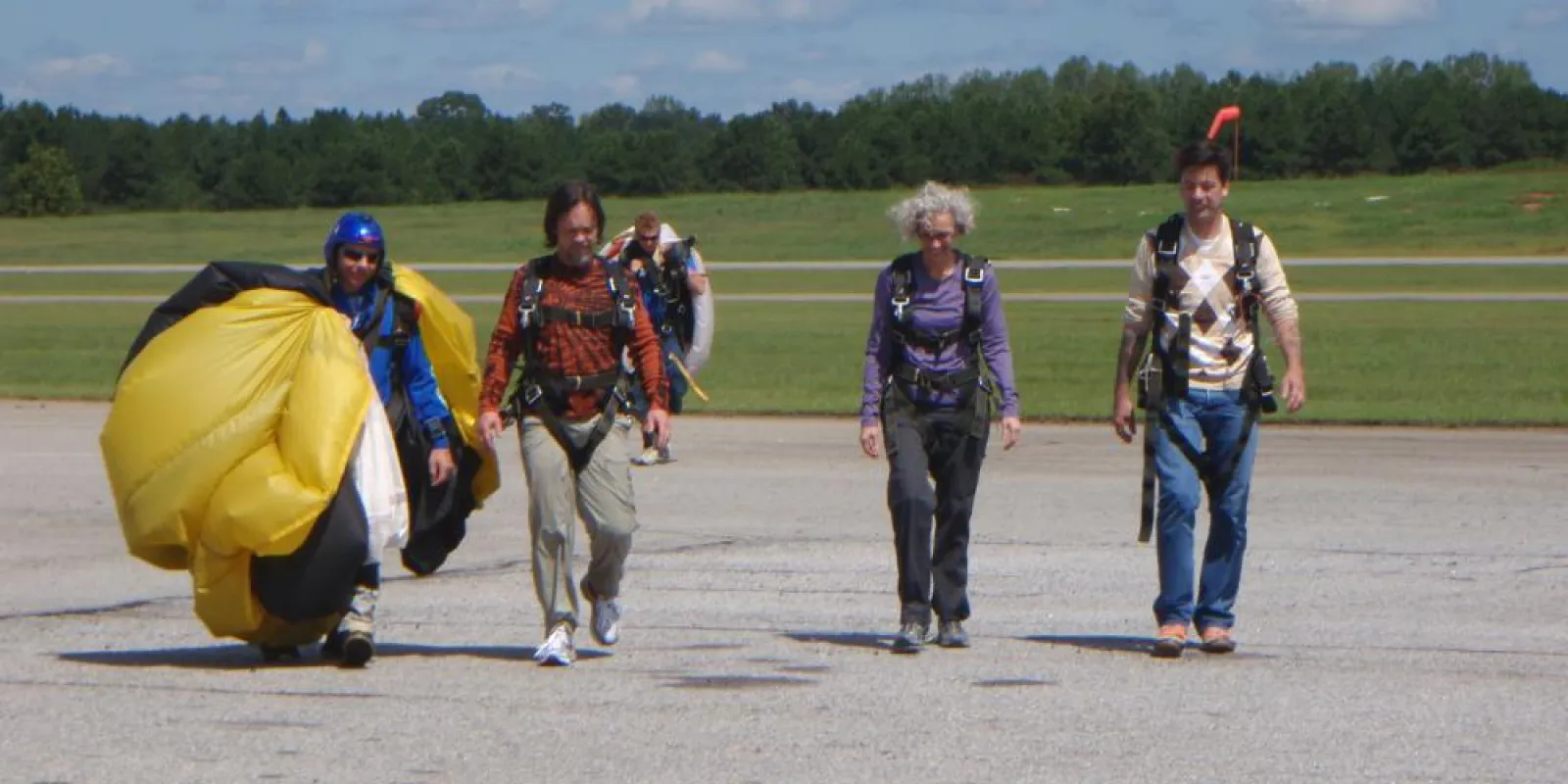 people walking back from sky diving
