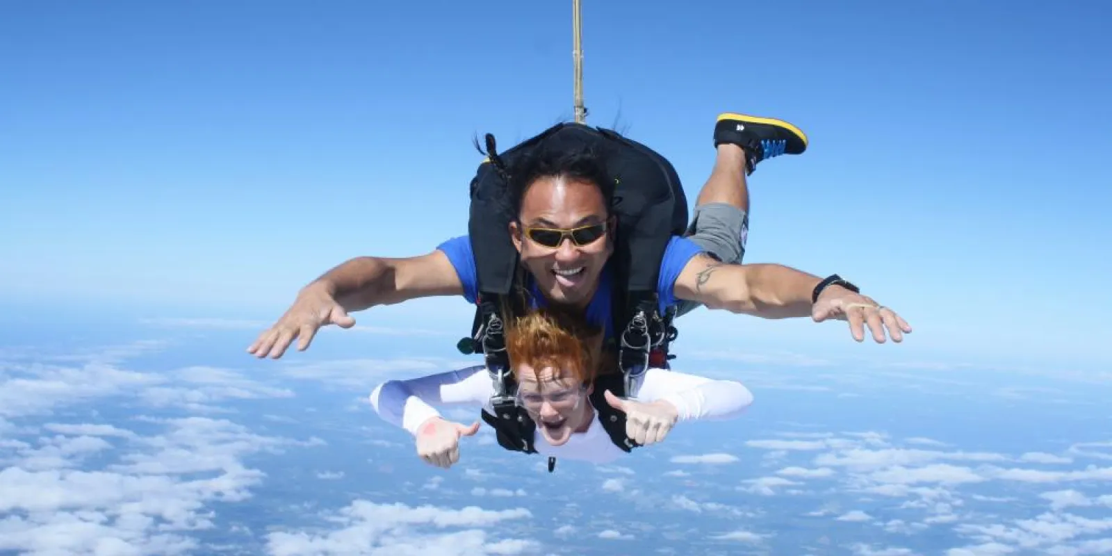 two people jumping out of a plane