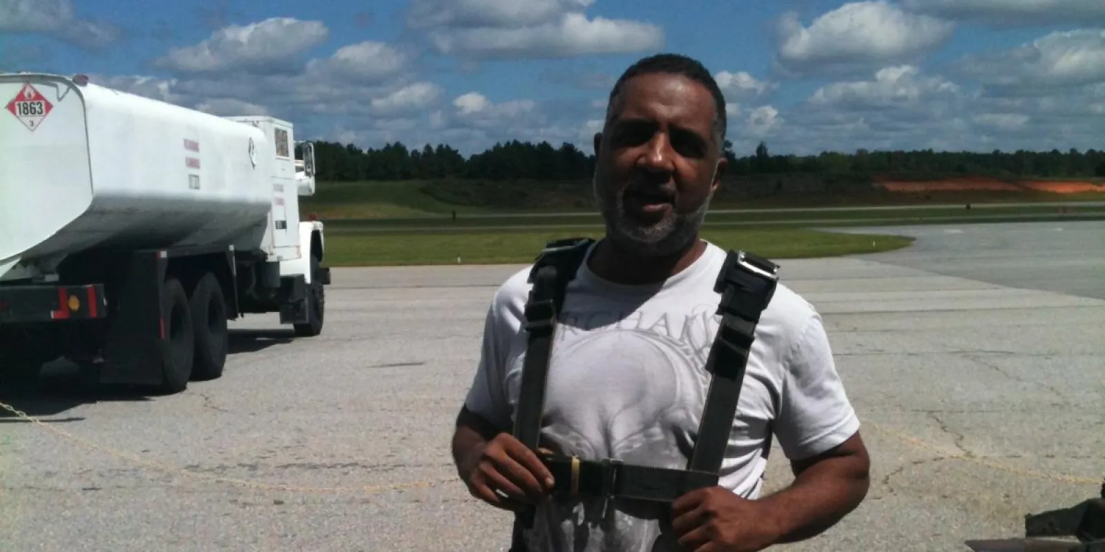 a man standing in front of a truck