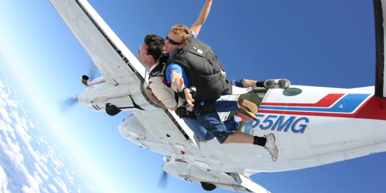 people jumping out of a plane
