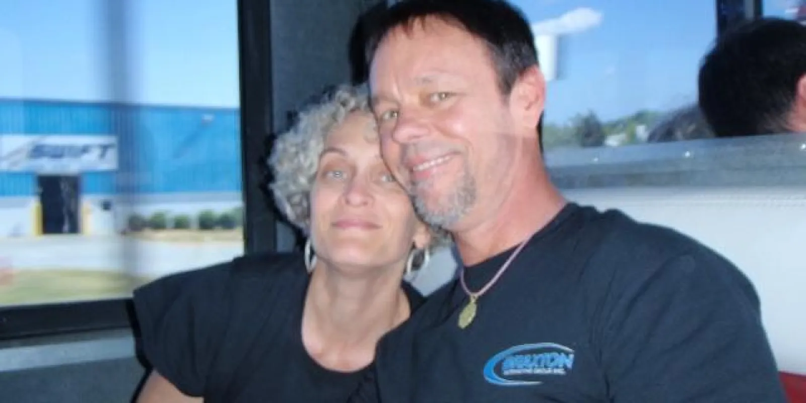 a couple sitting on a bus
