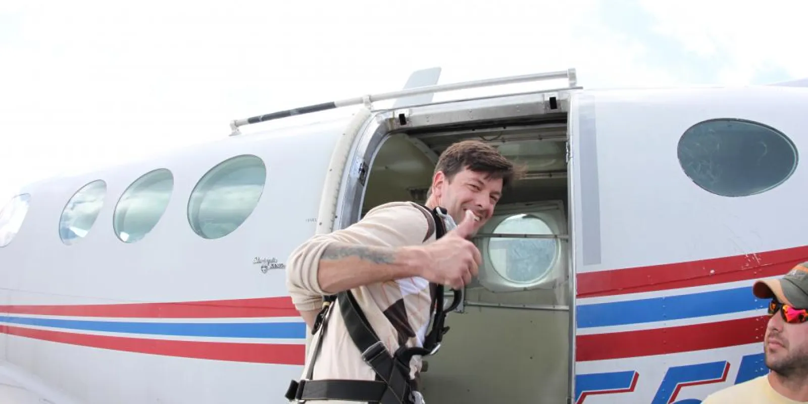 a man standing in front of a plane
