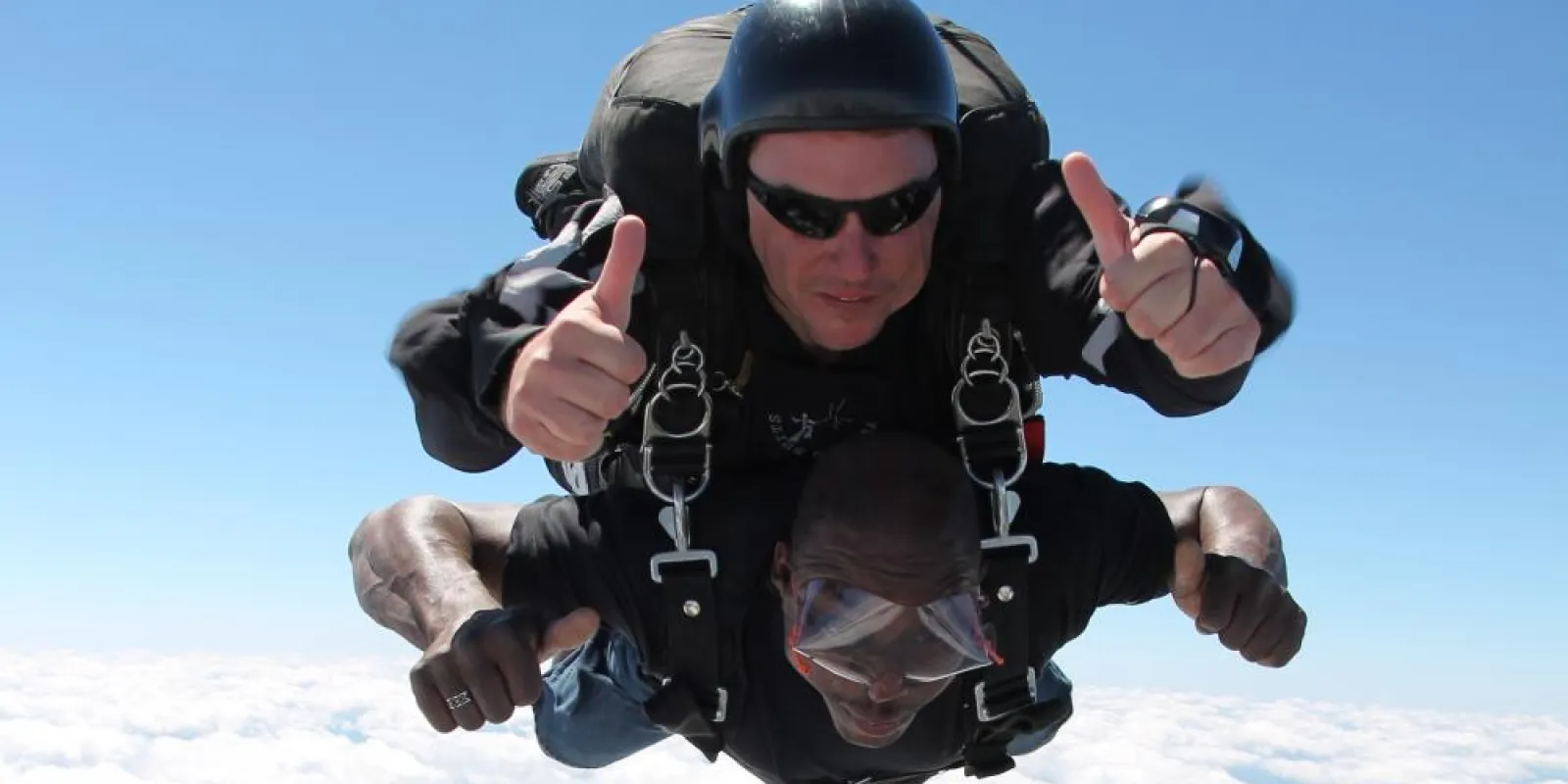 two people sky diving
