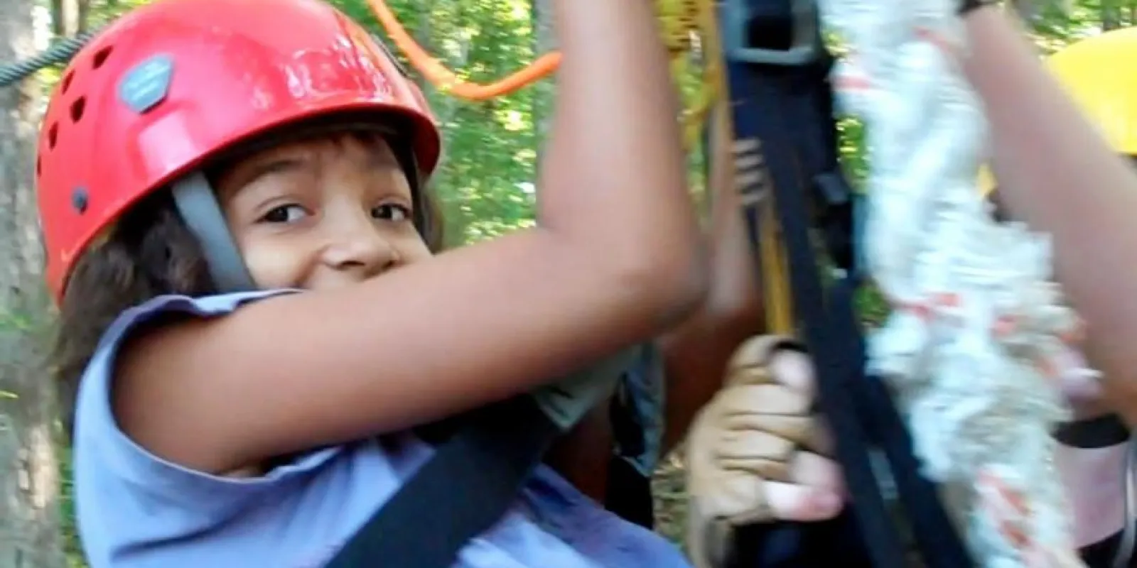 a close up of a child wearing a helmet