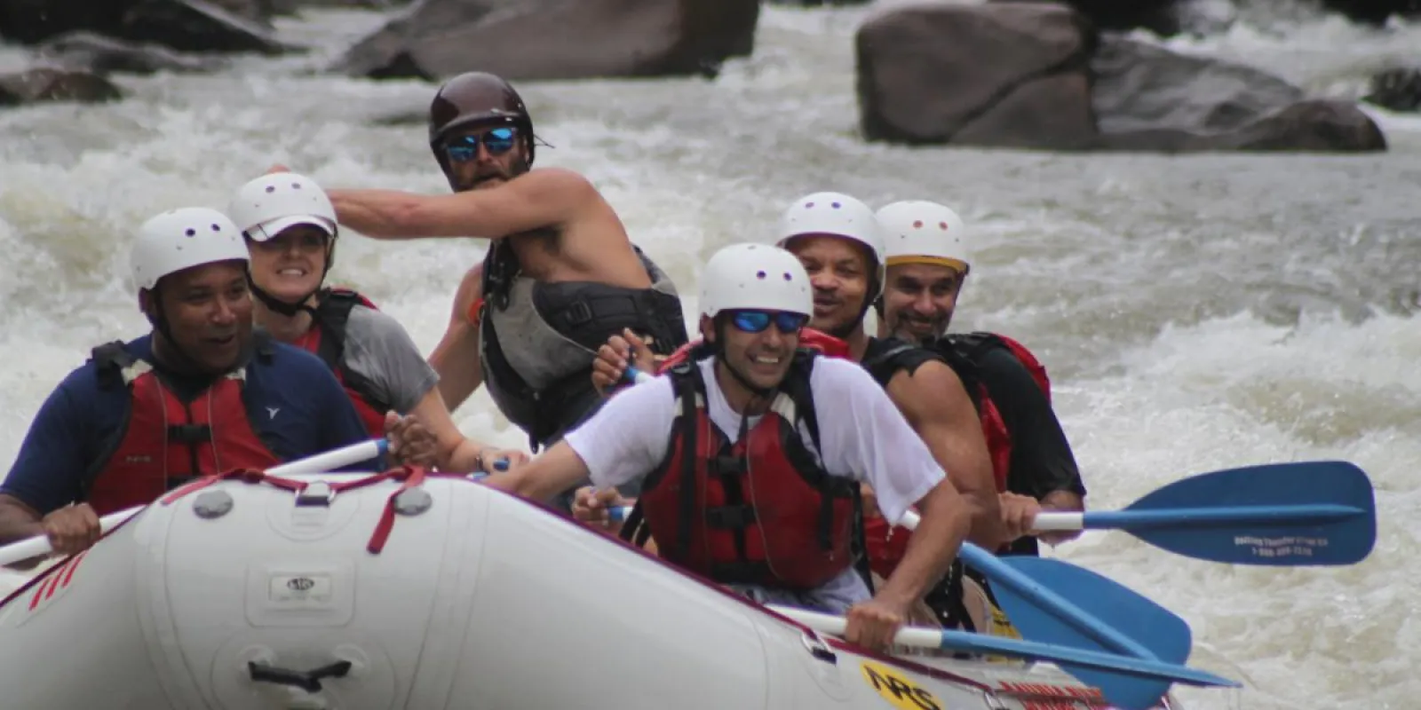 a group of people riding on a raft