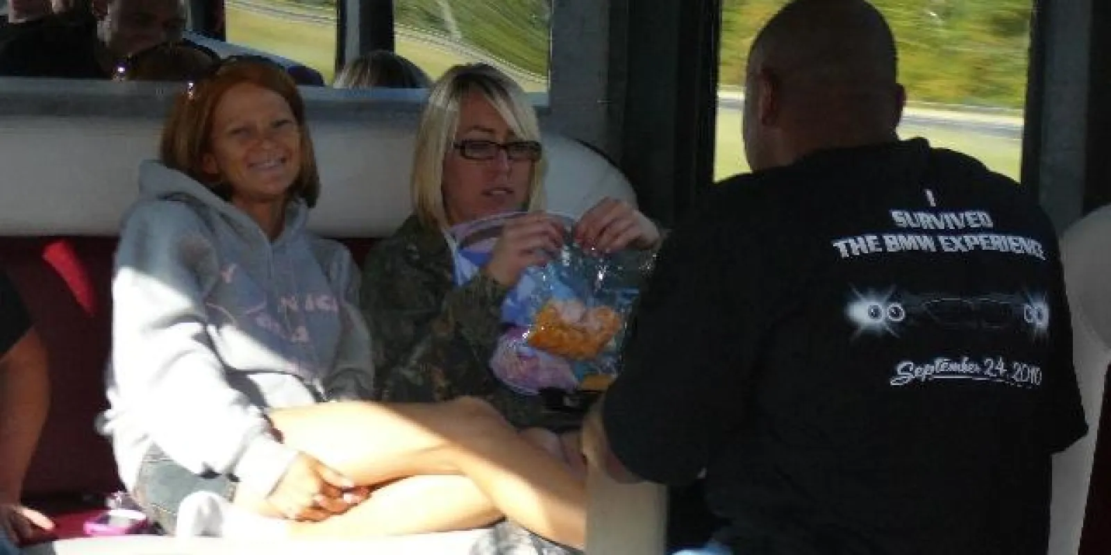 a group of people sitting on a bus