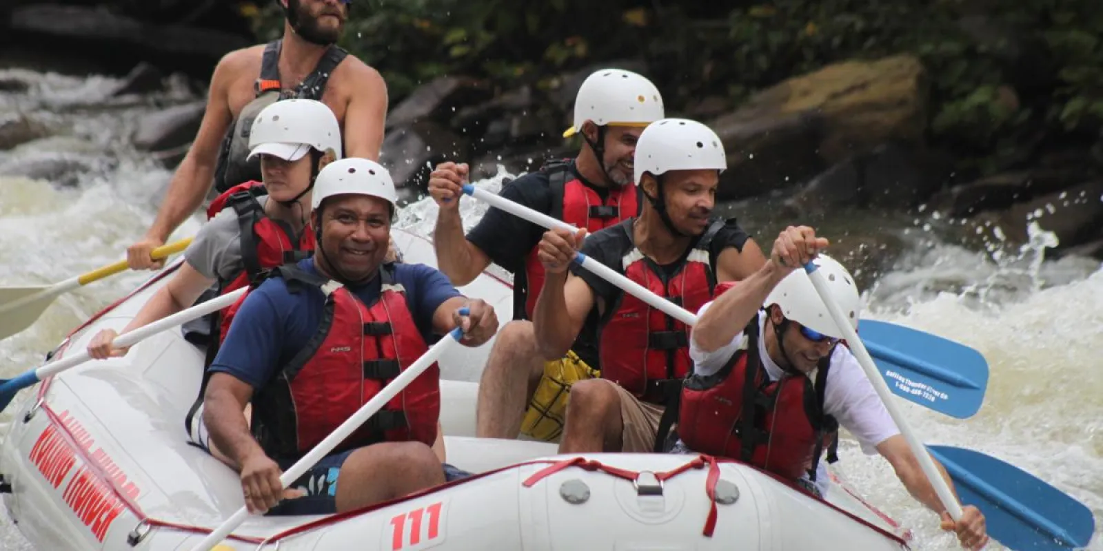 a group of people on a raft