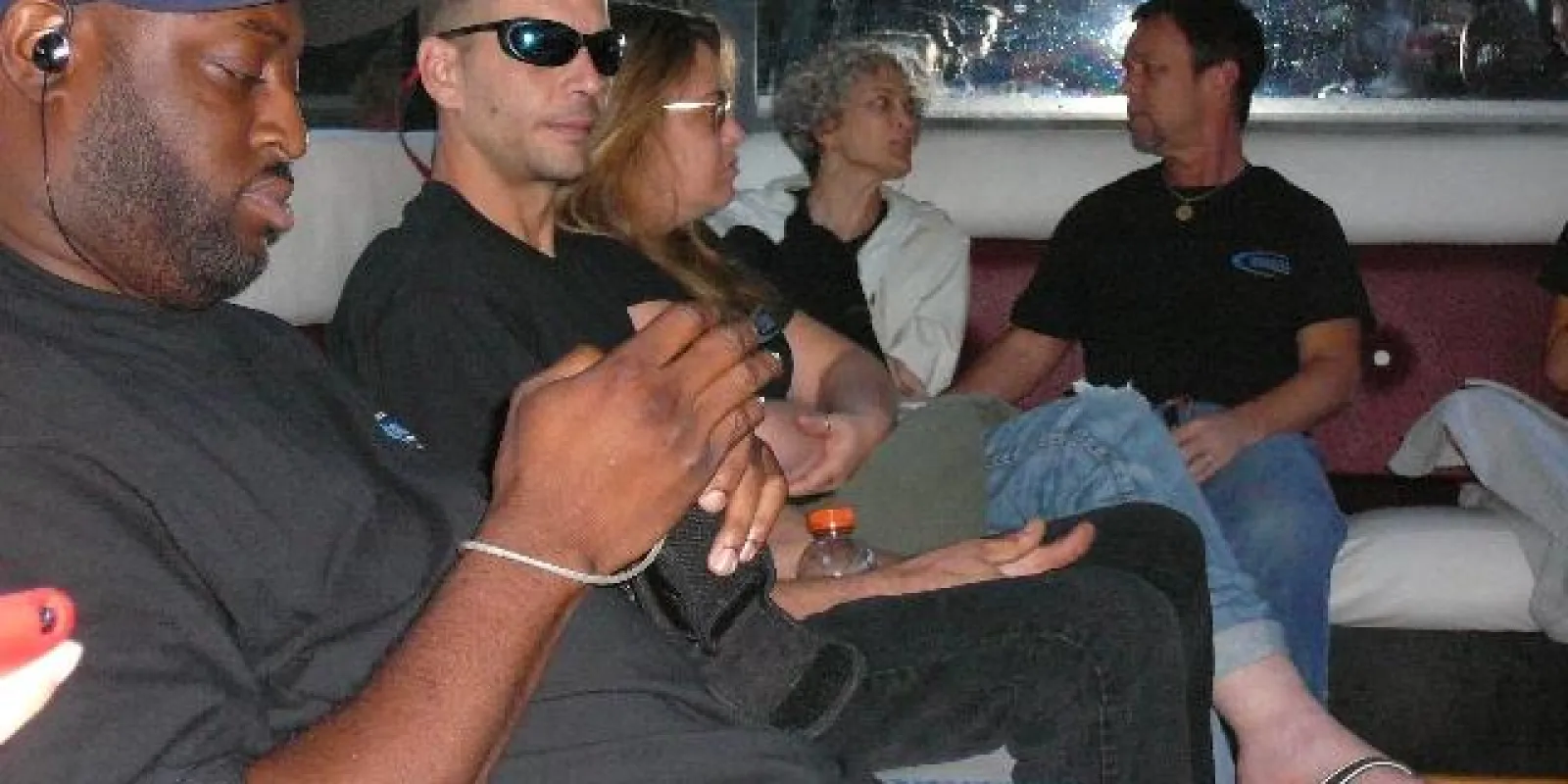 a group of people sitting on a bus