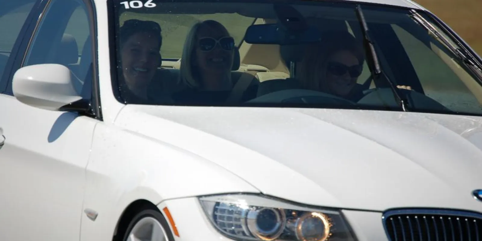 people smiling in a car