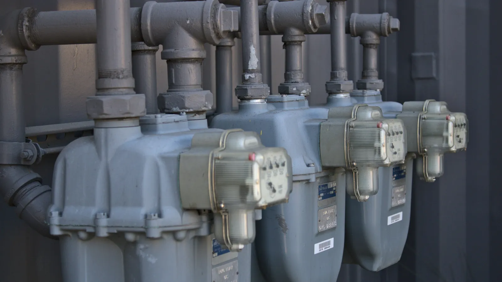several metal pipes with labels