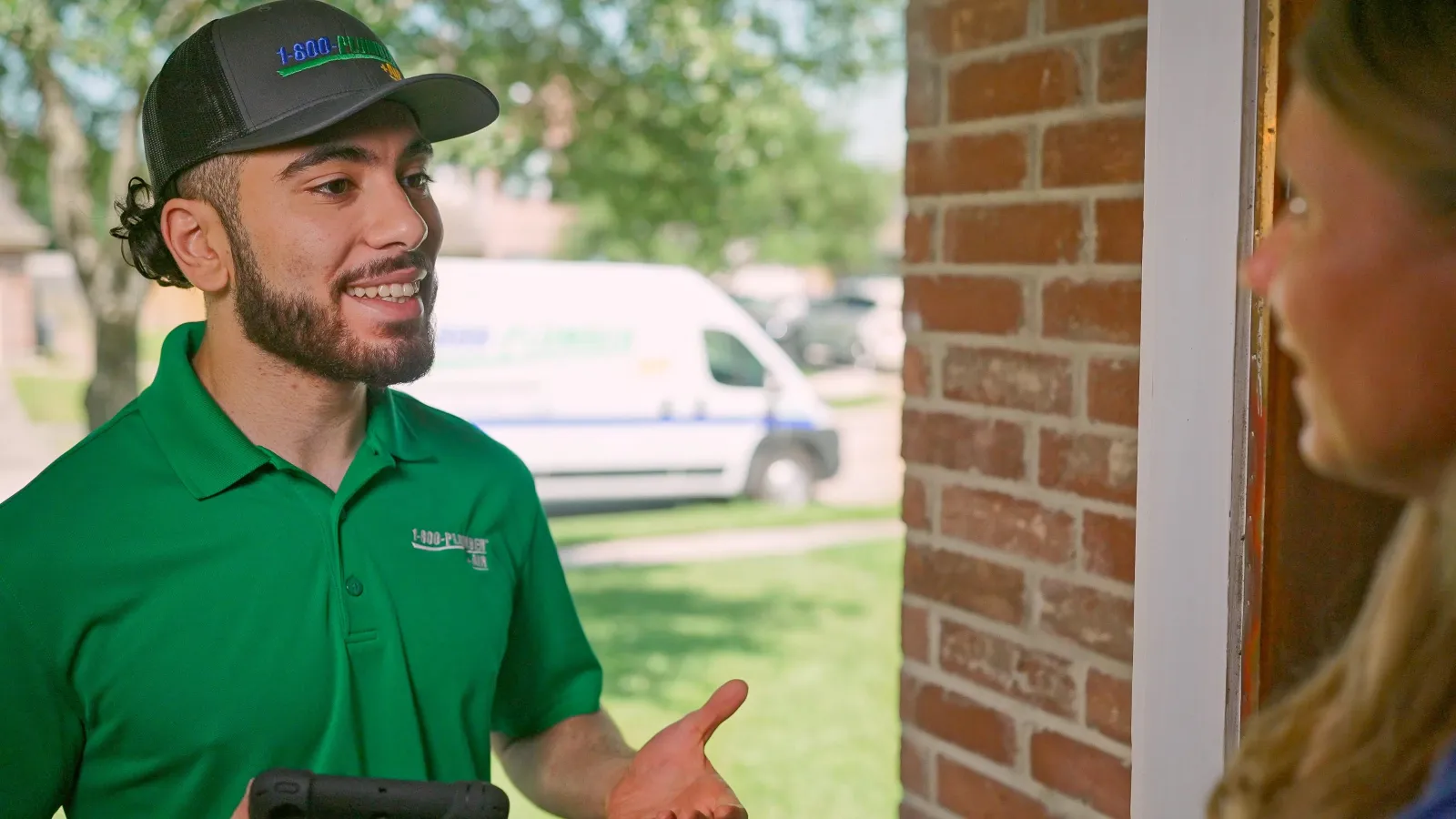 An emergency ac technician greeting a homeowner