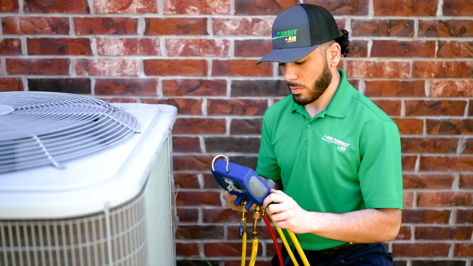 A Youngstown heating technician repairs an outdoor heater