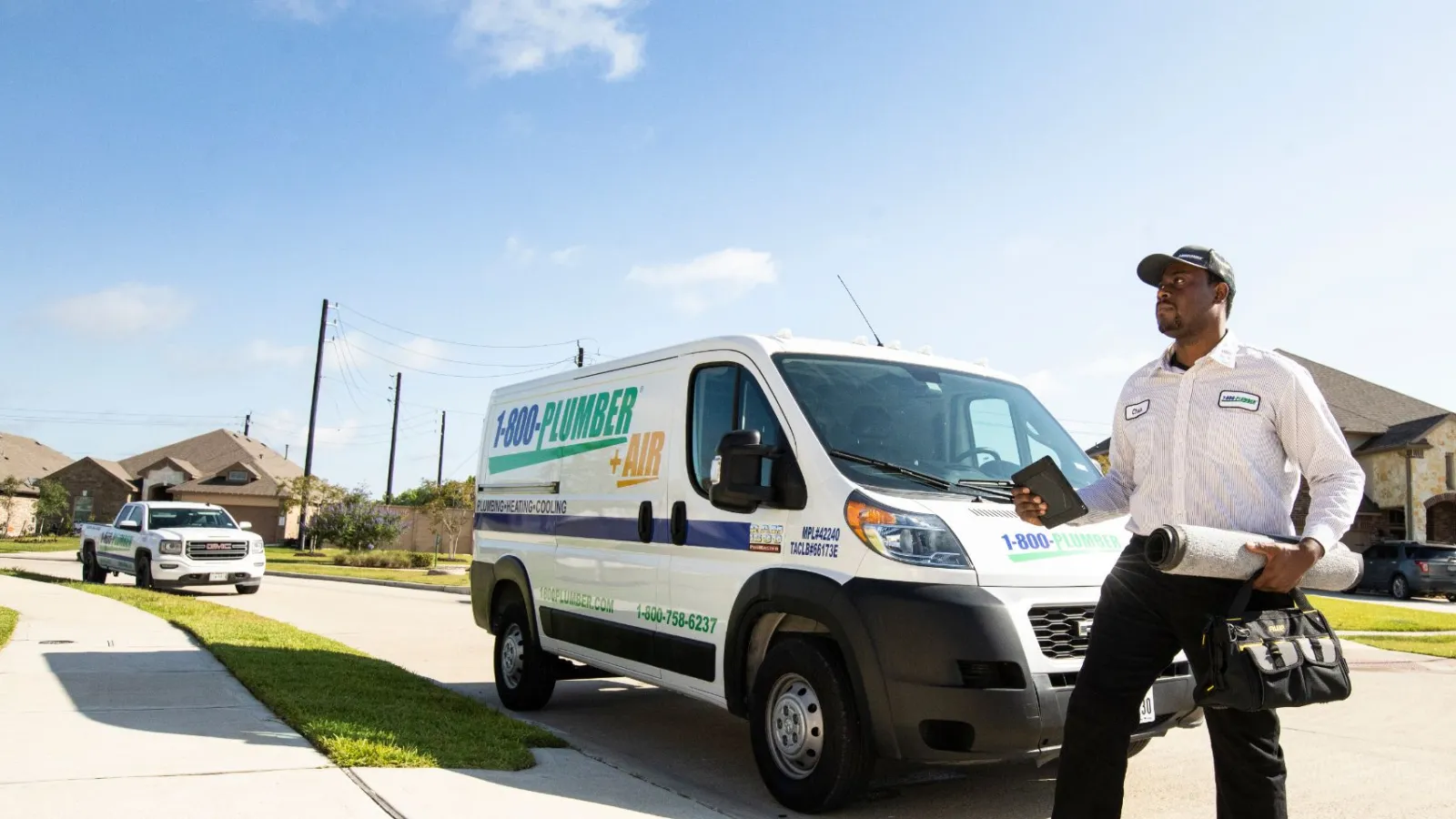 a man walking in front of a van