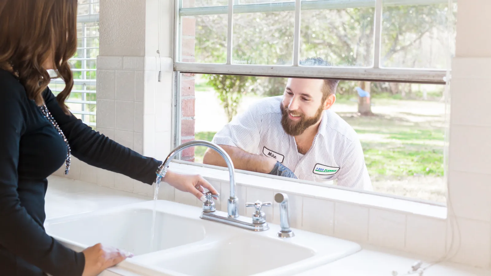 a woman standing in front of a sink