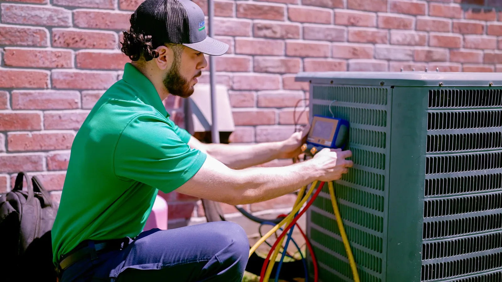 A Central Florida emergency heating technician repairs an AC unit