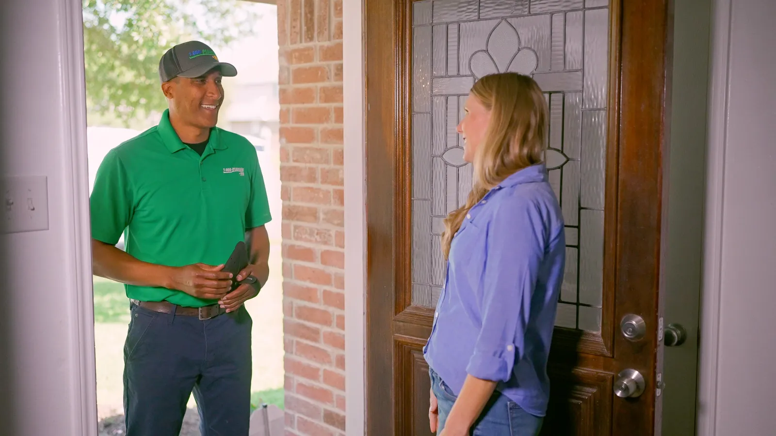 A Central Florida Emergency Plumbing technician greets a homeowner