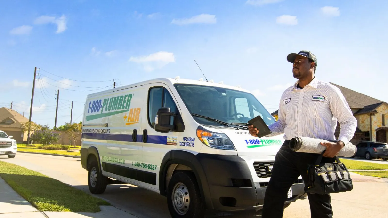 a man walking in front of a van