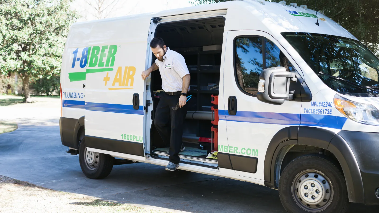 a man stepping out of a van