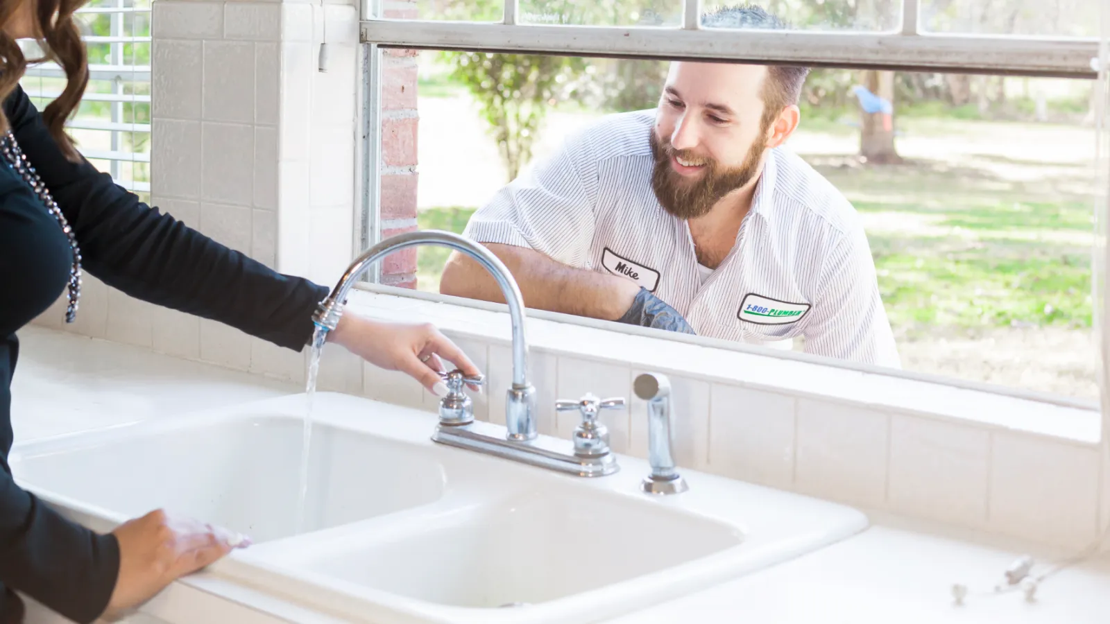 A woman standing in front of a sink