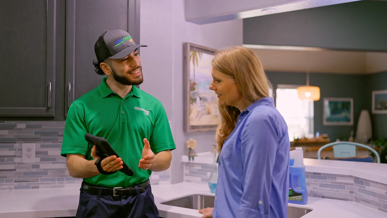 a Houston plumber in a kitchen