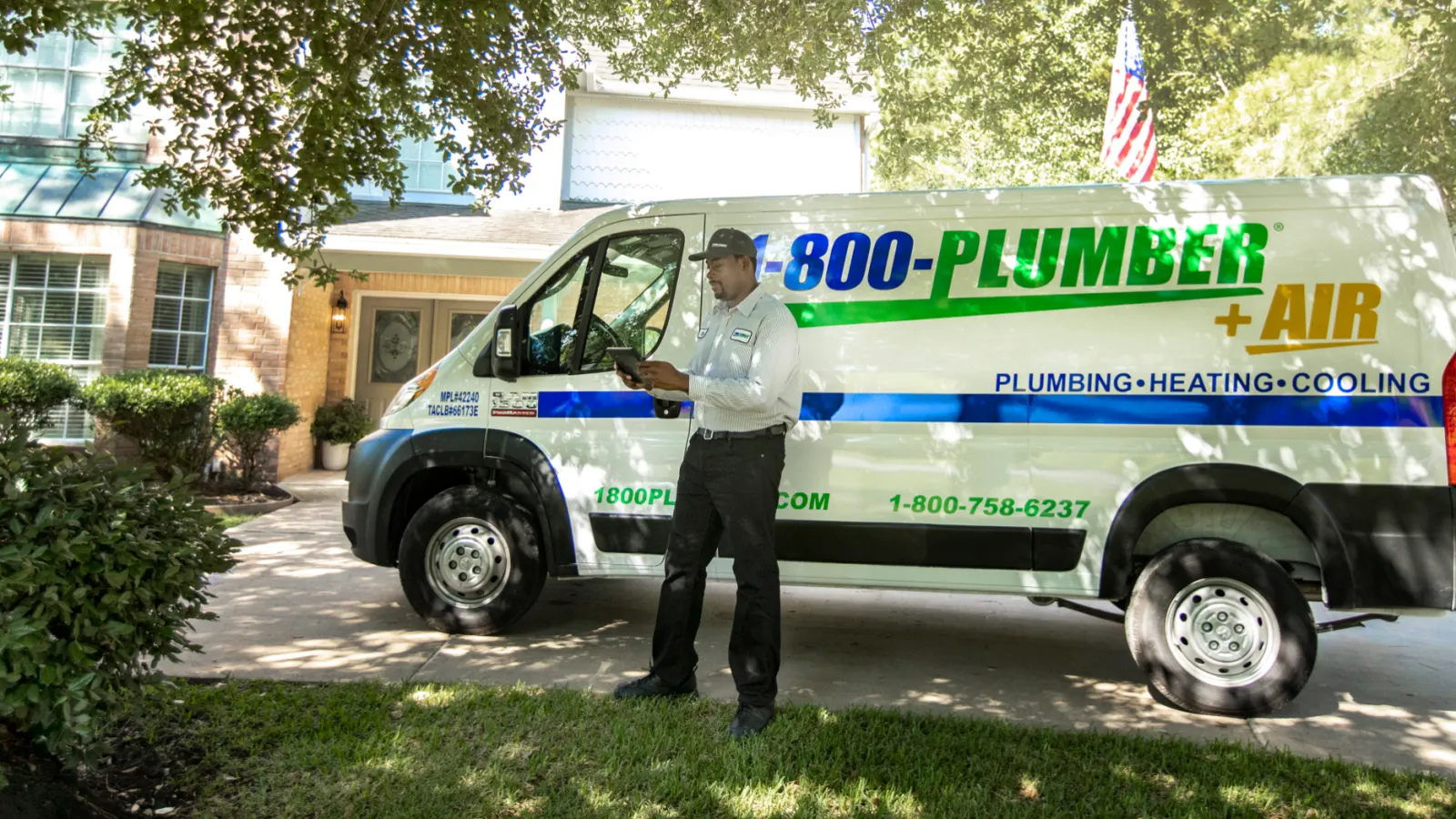 a man standing in front of house