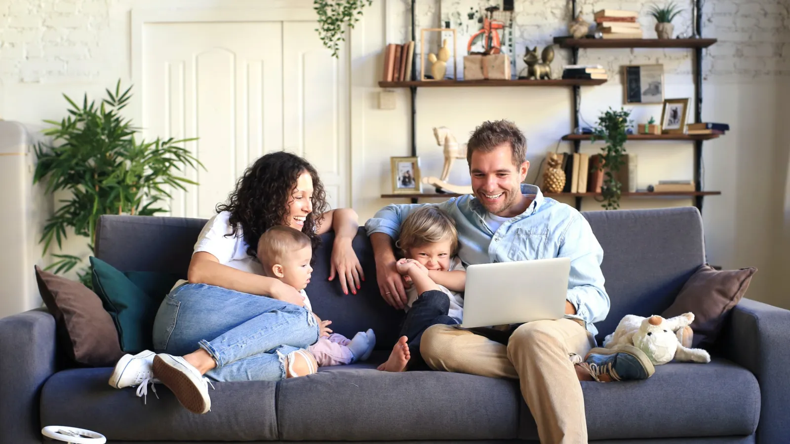 a family sits on a couch