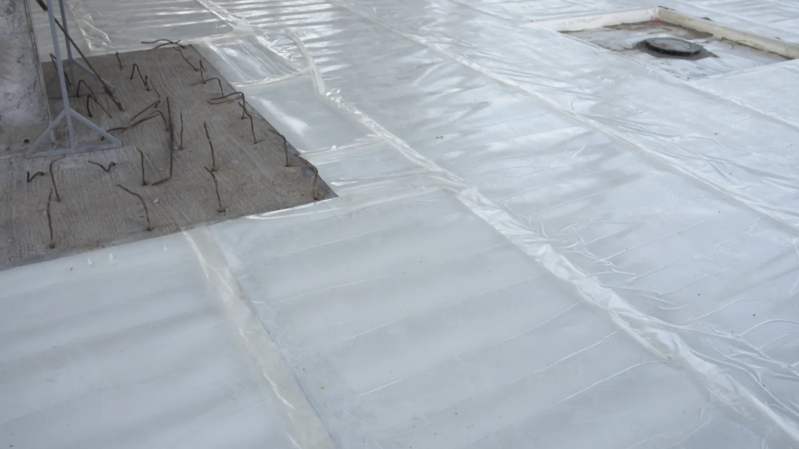A close up of a singly-ply membrane roofing system