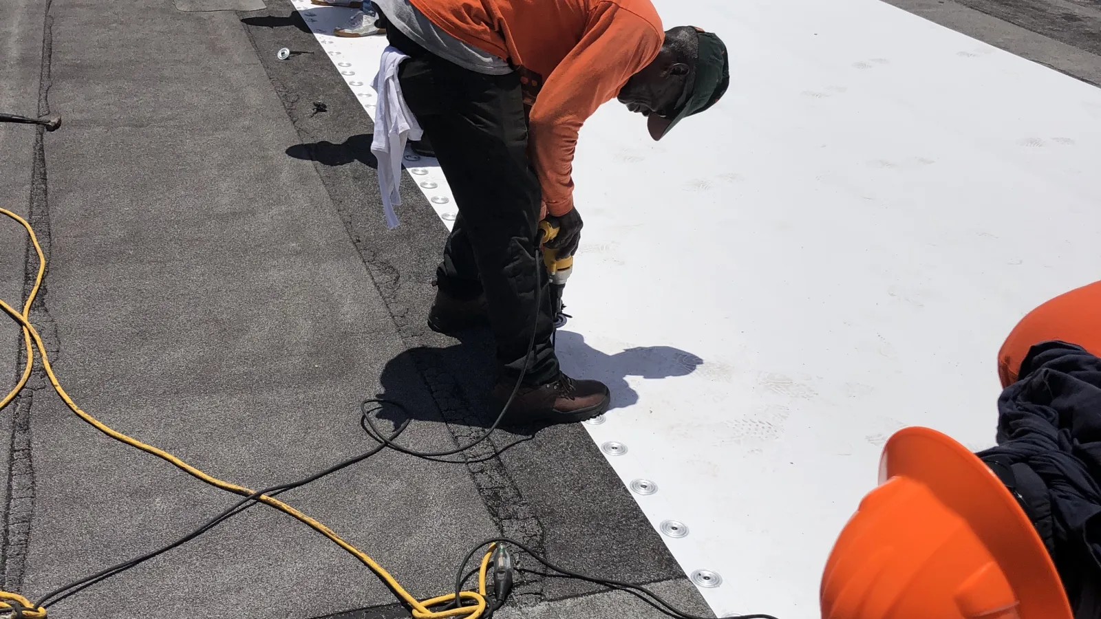 The Best Roofing team working on a commercial roof restoration project