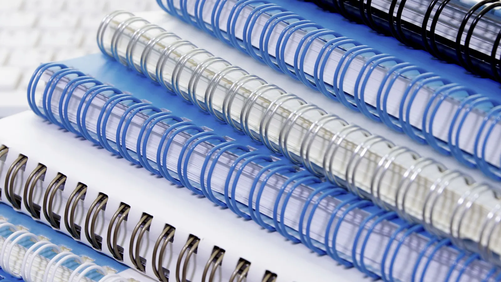 A close-up of assorted Wire-O Bound Books