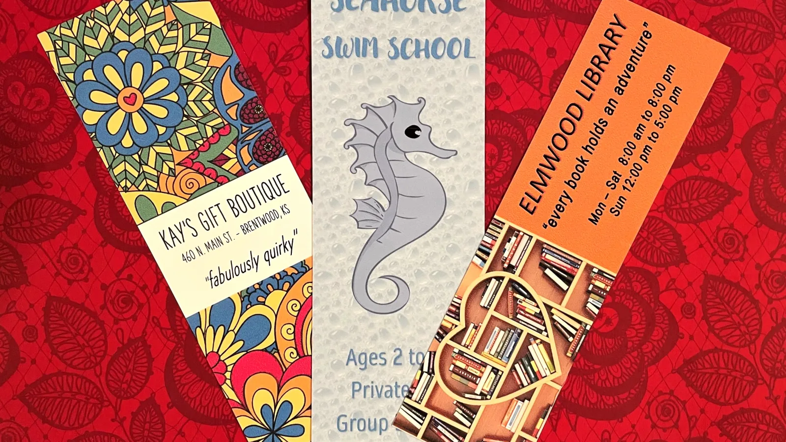 Three promotional Bookmarks against a red background