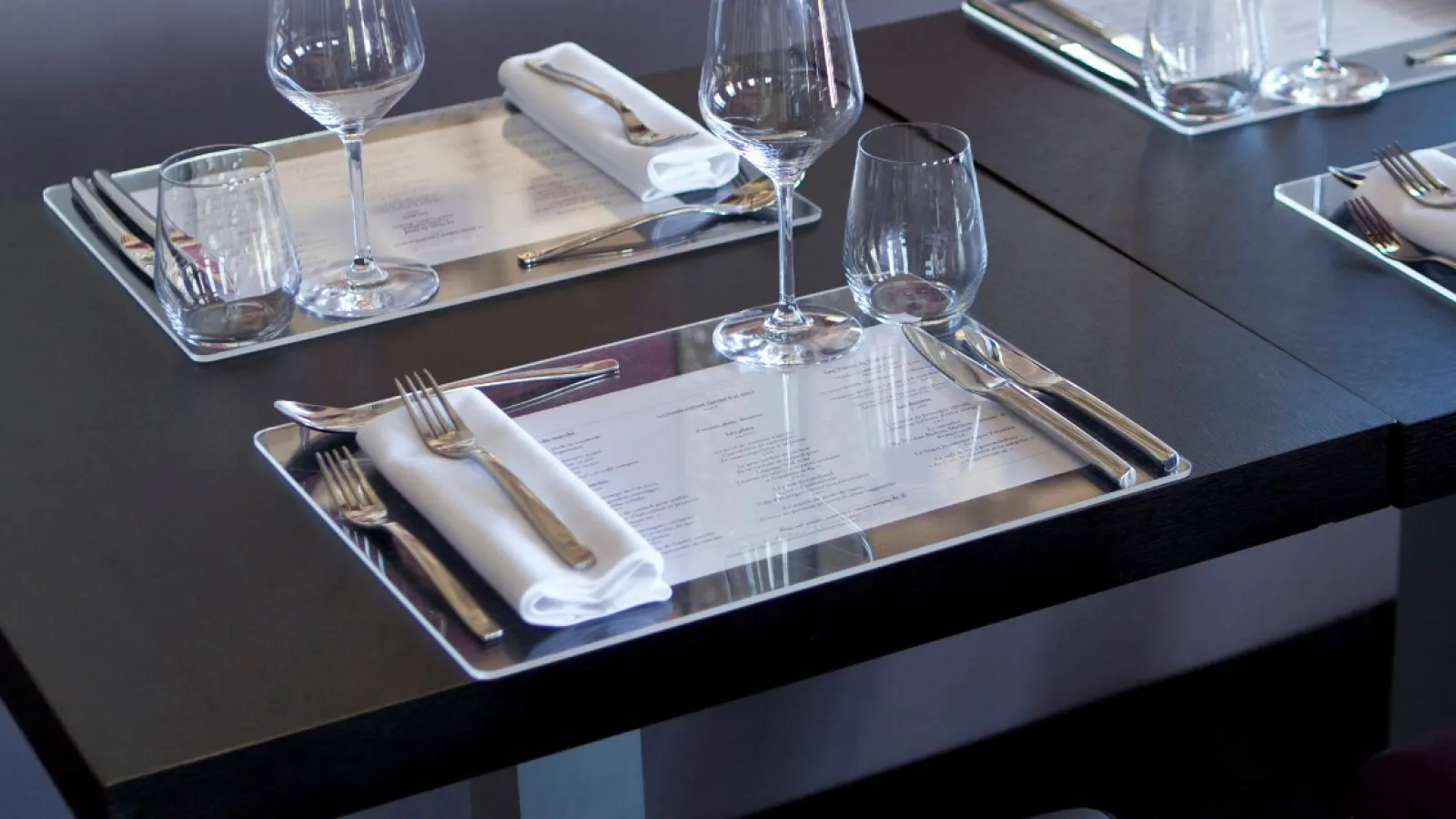 An restaurant table setting with Printed Placemats