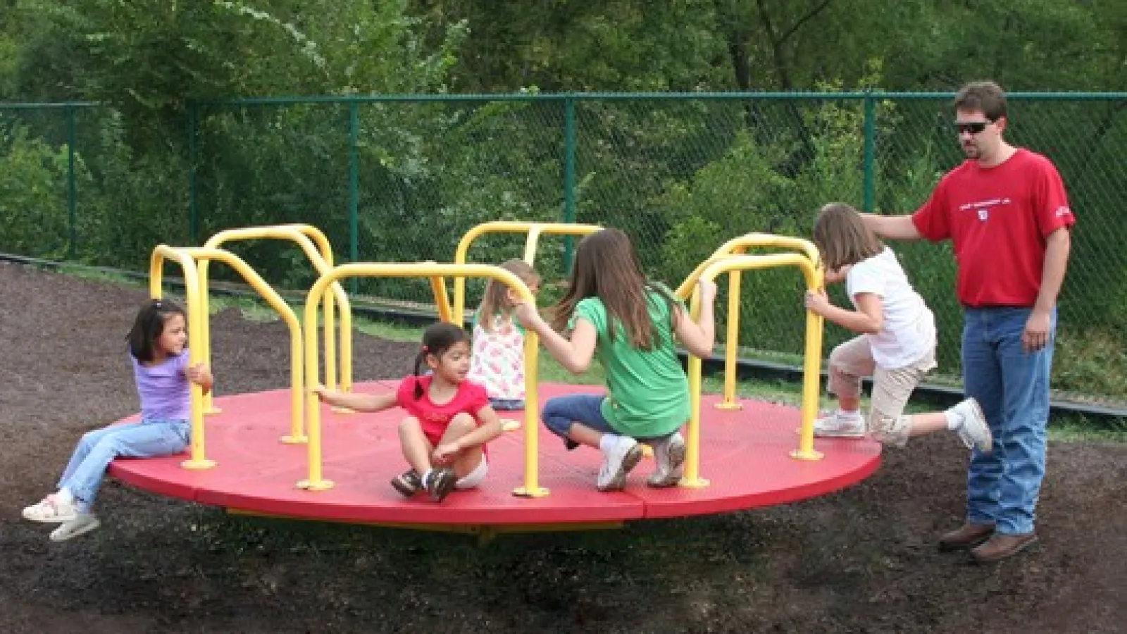 a group of people playing on a playground