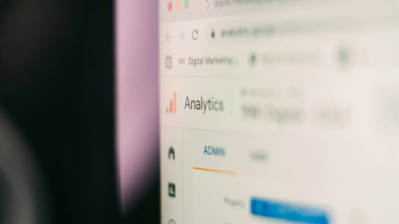 Close-up of a computer screen displaying a digital marketing analytics dashboard with admin options.