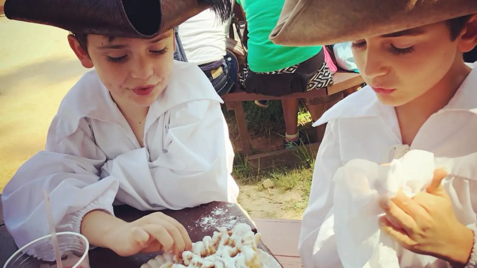 kids eating a funnel cake