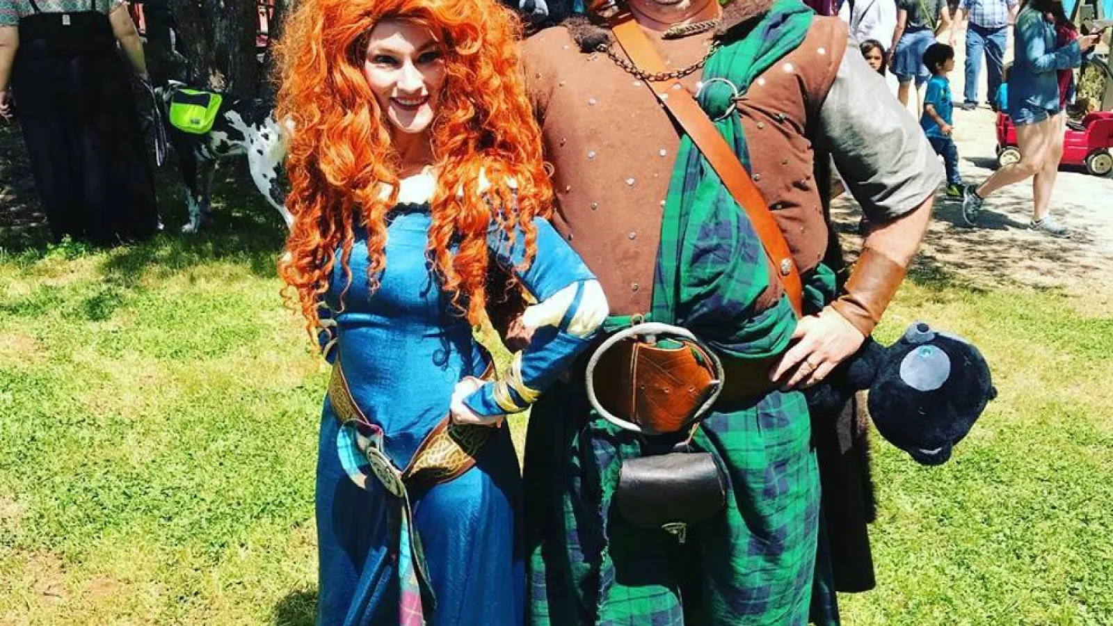 a man and woman dressed up in clothing