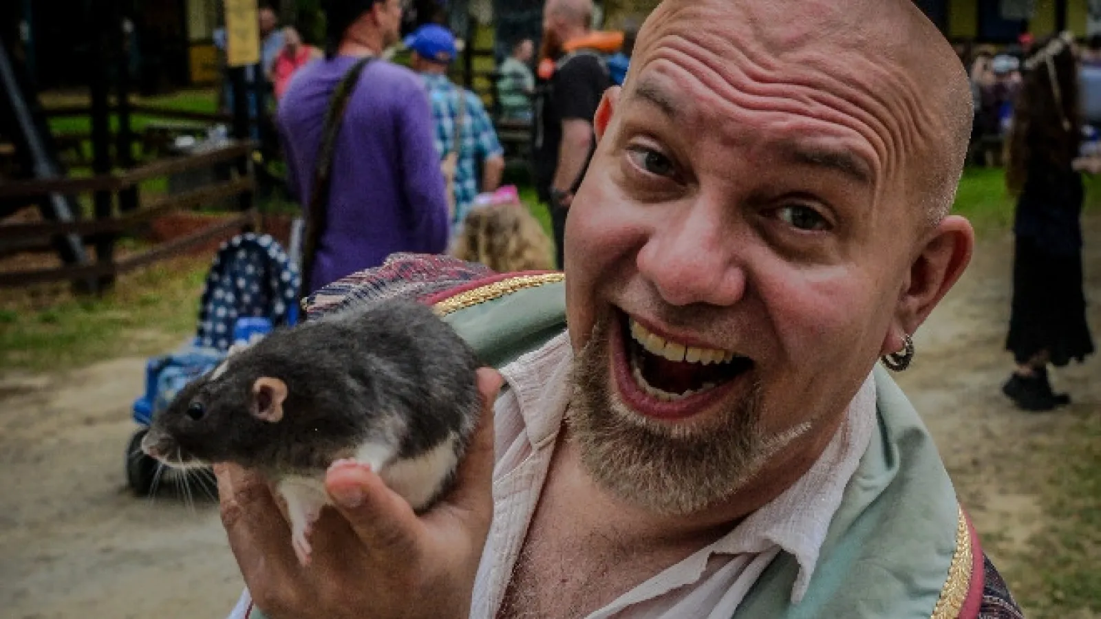 a man holding a small animal